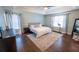 Spacious bedroom with hardwood floors and large windows at 1134 Harbor Hill St, Winter Garden, FL 34787