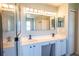 Double vanity bathroom with large mirror and walk-in shower at 1134 Harbor Hill St, Winter Garden, FL 34787