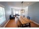 Open living room with hardwood floors, large windows, and comfortable seating at 1134 Harbor Hill St, Winter Garden, FL 34787