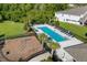 Community pool with lounge chairs and a fitness area at 3387 Beaute Dr, Kissimmee, FL 34746