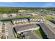 Aerial view of townhomes near a lake and businesses at 3387 Beaute Dr, Kissimmee, FL 34746