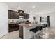 Modern kitchen with granite countertops and dark wood cabinets at 3387 Beaute Dr, Kissimmee, FL 34746