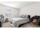 Bright bedroom with a queen bed and sitting chair at 3387 Beaute Dr, Kissimmee, FL 34746