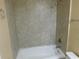 Bathroom with shower/tub combo and tiled walls at 200 Afton Sq # 102, Altamonte Springs, FL 32714