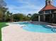 Community pool area with surrounding landscaping at 200 Afton Sq # 102, Altamonte Springs, FL 32714