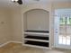 Built-in shelving and French doors highlight this living room at 200 Afton Sq # 102, Altamonte Springs, FL 32714