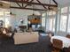 Spacious community room with seating, kitchen, and high ceilings at 200 Afton Sq # 102, Altamonte Springs, FL 32714
