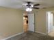 Bedroom with carpet, ceiling fan and access to kitchen at 200 Afton Sq # 102, Altamonte Springs, FL 32714