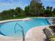 Community swimming pool with spacious deck at 200 Afton Sq # 102, Altamonte Springs, FL 32714