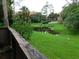 Tranquil pond view from private deck; lush landscaping and community buildings in background at 200 Afton Sq # 102, Altamonte Springs, FL 32714