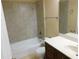 Bathroom with shower/tub combo, vanity, and tiled walls at 200 Afton Sq # 102, Altamonte Springs, FL 32714