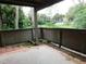 Private patio with wood fencing and view of lush greenery at 200 Afton Sq # 102, Altamonte Springs, FL 32714