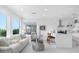Open concept living room and kitchen with water views at 8629 Saint Marino Blvd, Orlando, FL 32836