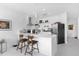 Modern kitchen with white cabinetry and island at 8629 Saint Marino Blvd, Orlando, FL 32836