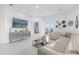 Spacious living room with large TV and comfortable seating at 8629 Saint Marino Blvd, Orlando, FL 32836
