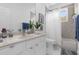 Bathroom with tub shower combo, vanity, and neutral tile at 8629 Saint Marino Blvd, Orlando, FL 32836