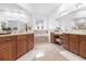 Luxurious bathroom with double vanities and soaking tub at 8629 Saint Marino Blvd, Orlando, FL 32836