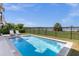 Relaxing pool with lake view and patio at 8629 Saint Marino Blvd, Orlando, FL 32836