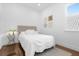 Cozy bedroom with a comfortable bed and hardwood floors at 8629 Saint Marino Blvd, Orlando, FL 32836