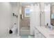 Updated bathroom with tub shower combo and neutral tile at 8629 Saint Marino Blvd, Orlando, FL 32836