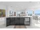 Modern kitchen with island, stainless steel appliances, and water views at 8629 Saint Marino Blvd, Orlando, FL 32836