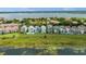 Aerial view of lakefront homes with private pools and lush landscaping at 8629 Saint Marino Blvd, Orlando, FL 32836