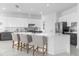 Modern kitchen with white and gray cabinets, a large island, and stainless steel appliances at 8629 Saint Marino Blvd, Orlando, FL 32836