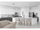 Modern kitchen with white and gray cabinets, a large island, and stainless steel appliances at 8629 Saint Marino Blvd, Orlando, FL 32836