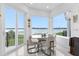 Bright dining area with lake views and modern furnishings at 8629 Saint Marino Blvd, Orlando, FL 32836