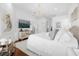 Spacious bedroom with large bed and mirrored furniture at 8629 Saint Marino Blvd, Orlando, FL 32836