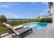 Stunning pool with lake view and lounge chairs at 8629 Saint Marino Blvd, Orlando, FL 32836