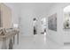 Elegant hallway with high ceilings and large format tile flooring at 8629 Saint Marino Blvd, Orlando, FL 32836
