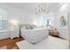 Main bedroom with water views and elegant chandelier at 8629 Saint Marino Blvd, Orlando, FL 32836