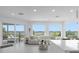 Living room with sliding glass doors and water views at 8629 Saint Marino Blvd, Orlando, FL 32836