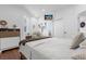 Bright bedroom with hardwood floors and plush bedding at 8629 Saint Marino Blvd, Orlando, FL 32836
