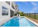 Inviting pool with lake view and patio at 8629 Saint Marino Blvd, Orlando, FL 32836
