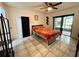 Second bedroom with a double bed and built-in shelving at 122 Crown Point Cir, Longwood, FL 32779
