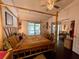 Main bedroom with a canopy bed and access to balcony at 122 Crown Point Cir, Longwood, FL 32779