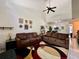 Spacious living room with high ceilings and two brown couches at 122 Crown Point Cir, Longwood, FL 32779