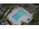 Community pool with surrounding lounge chairs and patio tables at 122 Crown Point Cir, Longwood, FL 32779
