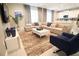 Spacious living room with sectional sofa and large TV at 171 Burma St, Kissimmee, FL 34747