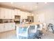 Modern kitchen with white cabinets and granite island at 171 Burma St, Kissimmee, FL 34747