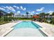 Inviting pool and spa area with lounge chairs and patio furniture at 171 Burma St, Kissimmee, FL 34747