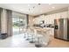 Modern kitchen with white cabinets and granite island at 171 Burma St, Kissimmee, FL 34747