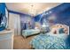 Two twin beds, Frozen-themed mural, and a chandelier at 171 Burma St, Kissimmee, FL 34747