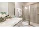 Bathroom with shower, toilet, and granite-topped vanity at 171 Burma St, Kissimmee, FL 34747