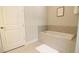 Relaxing bathroom with soaking tub and tile surround at 171 Burma St, Kissimmee, FL 34747