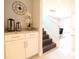 Entryway with built-in cabinets, granite countertop, and a view of the staircase at 171 Burma St, Kissimmee, FL 34747