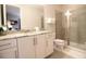 Bathroom with shower, toilet, and granite-topped vanity at 171 Burma St, Kissimmee, FL 34747