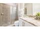 Bathroom with shower, toilet and granite-topped vanity at 171 Burma St, Kissimmee, FL 34747
